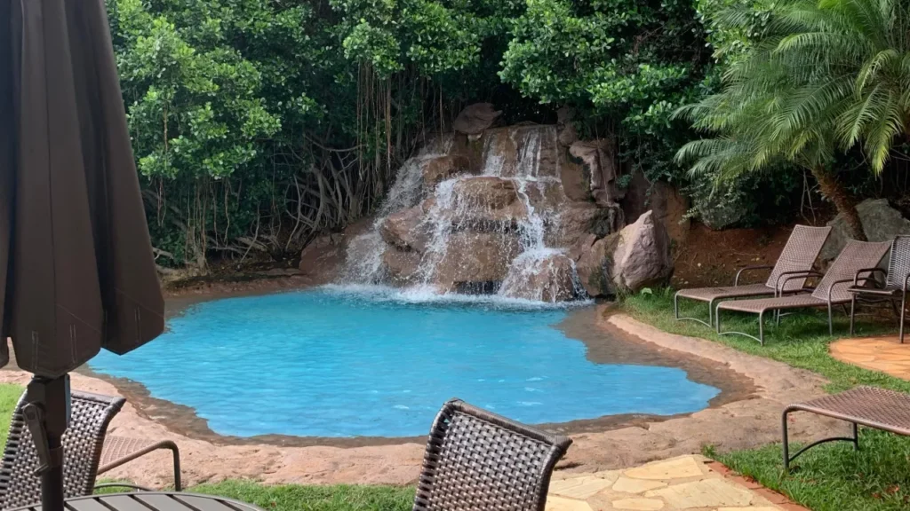 Rock waterfall feature spilling into a lagoon pool
