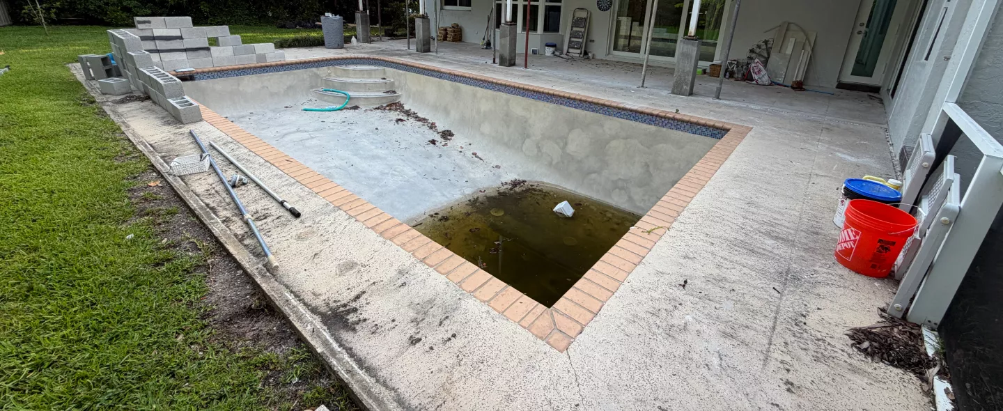 Sunken, uneven pool deck pavers before pool deck leveling repair